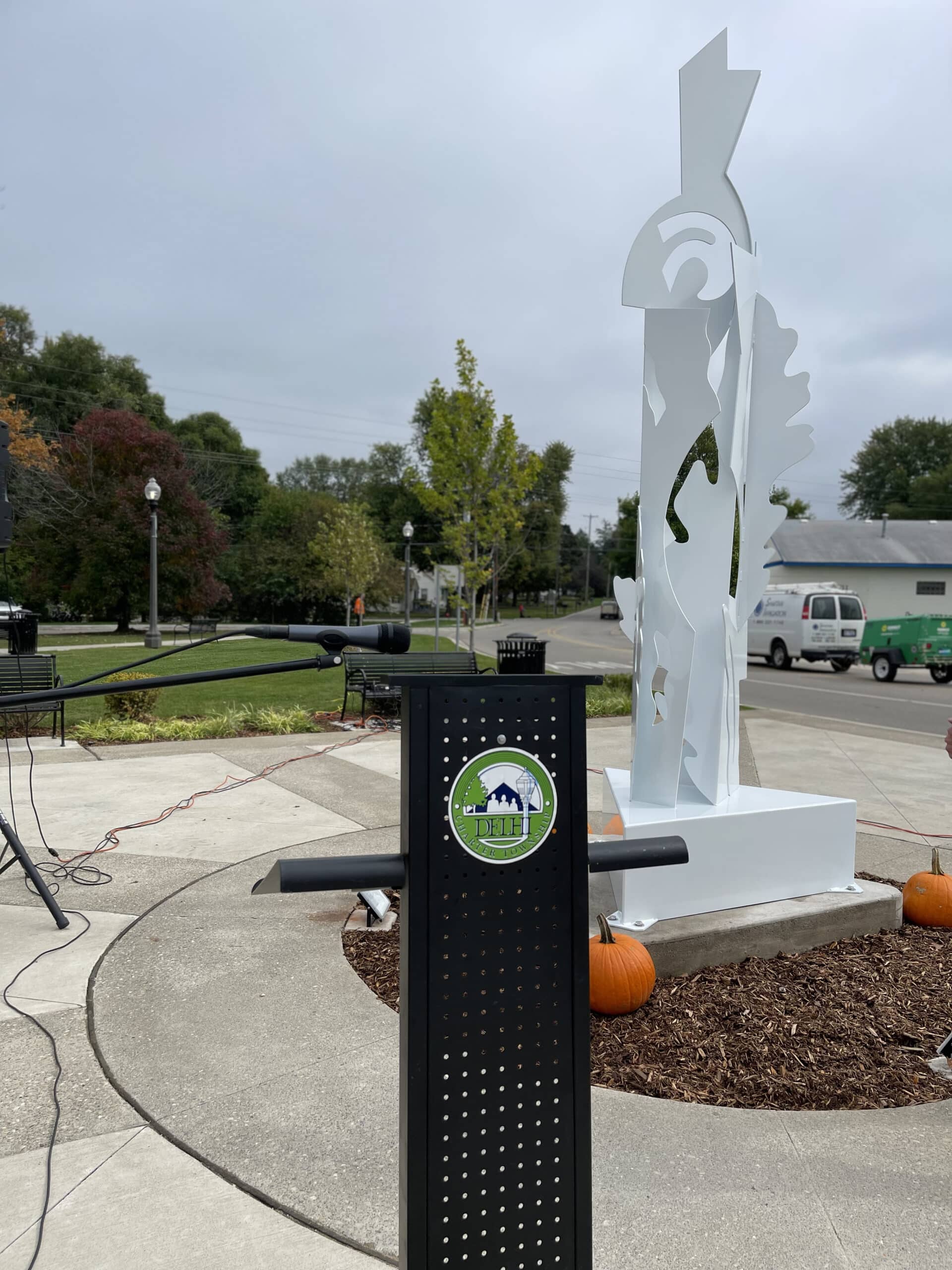 Picture showing a podium with the Delhi Township seal and Sculpture Garden V