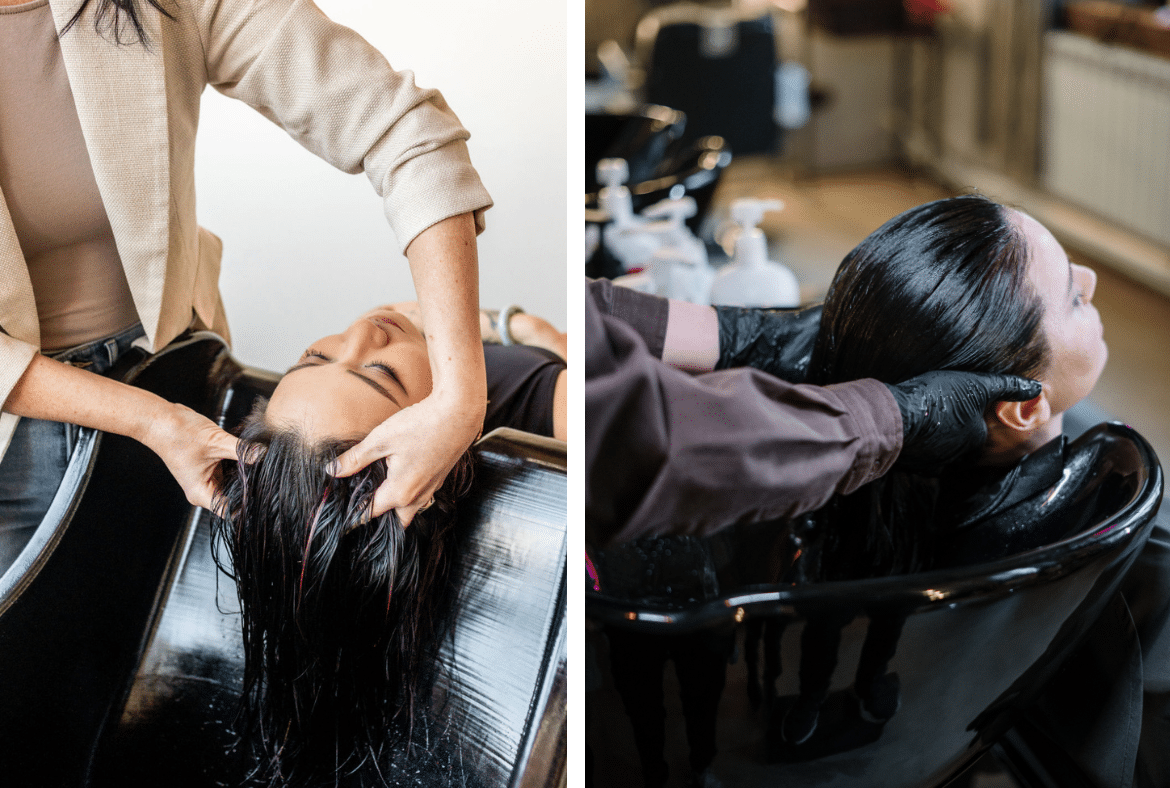 Hairstylist washing a client’s hair in a black salon wash basin.