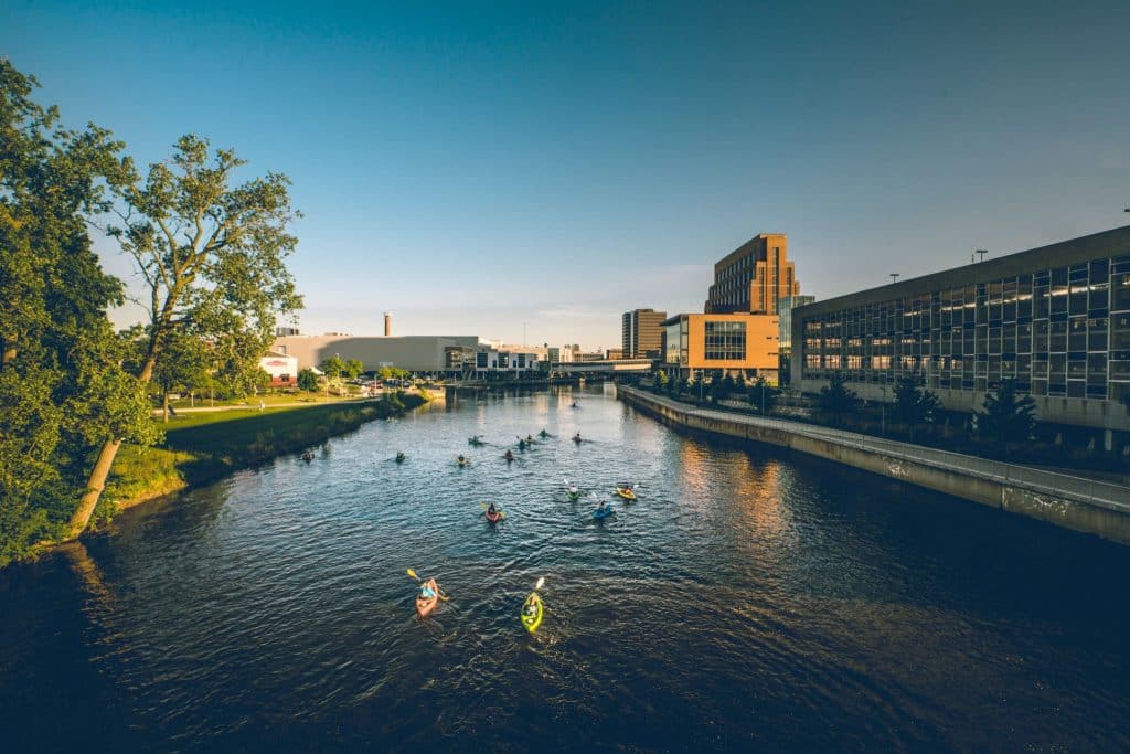 Aerial view of the Lansing, Michigan riverfront and skyline during the day.