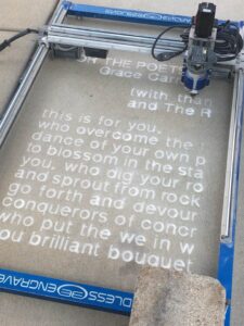 Picture of one of eight poems etched in sidewalks across Lansing, Mich. produced through the Lansing Sidewalk Poetry Project